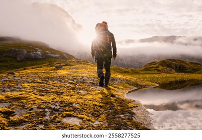 An Adventurous Hiker Embarking on a Journey to Explore a Scenic Mountainous Landscape - Powered by Shutterstock