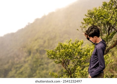 Adventurous Man Enjoying Scenic Mountain View. Scenic View from Mountain Peak. - Powered by Shutterstock