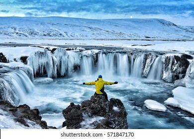 Adventurous man at Godafoss on Iceland