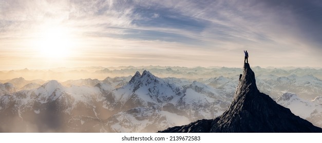 Adventurous Man Hiker standing on top of icy peak with rocky mountains in background. Adventure Composite. 3d Rendering rocks. Aerial Image of landscape from British Columbia, Canada. Sunset Sky - Powered by Shutterstock