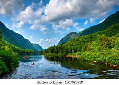 Adventurous People Rafting Jacques Cartier River On A Perfect Sunny Summer Day, Quebec, Canada