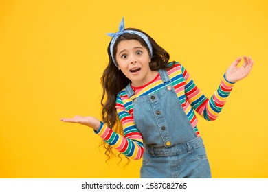 Advertisement Concept. Product Presentation. Kid Happy Smiling Face Show Something On Open Palm Copy Space Yellow Background. Girl Demonstrate Product. Promoting Product For Kids. Launching Product.