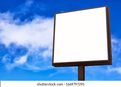 Advertisement mockup. Blank empty billboard against blue sky background