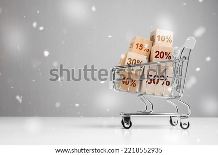 Advertisement, winter sale announcement. Shopping basket and boxes with sign discount percent. Advertising, announcement of winter or christmas, New Year's sale. copy space
