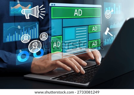 Advertising analytics and effectiveness measurement. Programmatic ads management. Marketer optimizing advertising performance on a laptop computer.