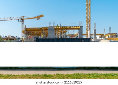 Advertising banner mock-up on the construction site fence - Shutterstock ID 2116519229