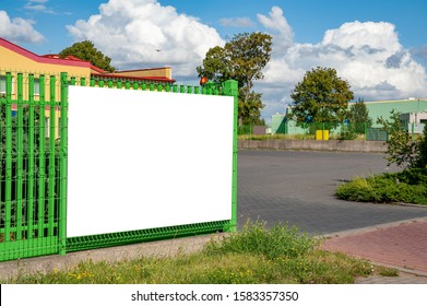 Advertising Banner Mockup On The Fence In Front Of Warehouse