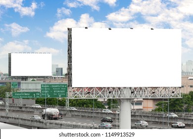 Advertising Concept, Blank Template For Outdoor Advertising Or Blank Billboard On The Highway In City. With Clipping Path On Screen - Can Be Used For Trade Shows, Promotional Poster.