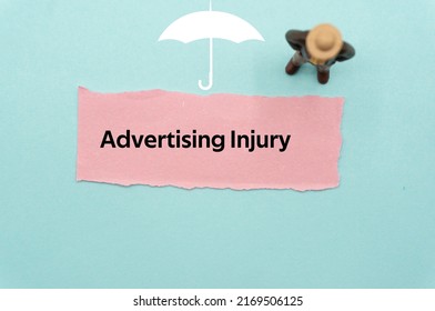 Advertising Injury.The word is written on a slip of colored paper. Insurance terms, health care words, Life insurance terminology. business Buzzwords.