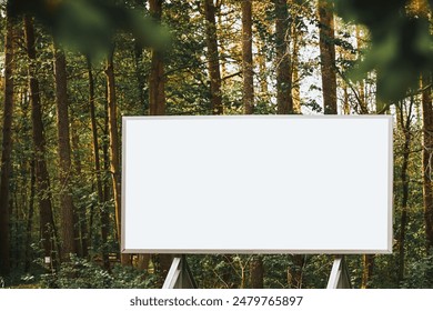 Advertising mockup space on empty billboard in lush green woods - Powered by Shutterstock