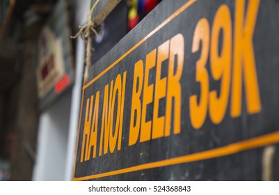 Advertising Sign For Hanoi Beer, The Popular Drink In Hanoi, Hang Outside Of A Side Walk Restaurant At Hanoi Old Quarter Street Area.