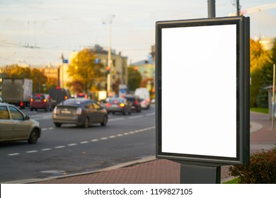 Advertising Space Under The Poster. Lightposter Citylight Mockup Small Billboard In The City Near The Roadway. White Space For Advertising