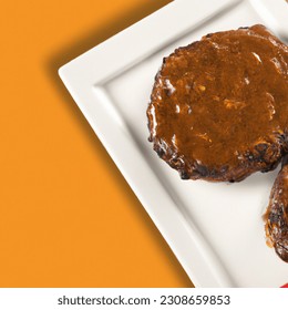 Advertising - testimonial photo of salisbury steak patties top view, lightly sauced