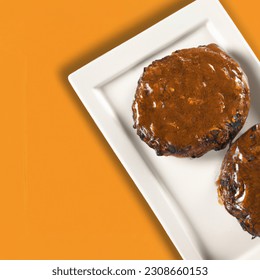 Advertising - testimonial photo of salisbury steak patties top view, lightly sauced