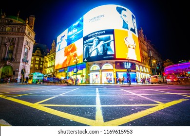 Adverts at Piccadilly Circus in London at night: LONDON,ENGLAND - AUGUST 16,2018: 