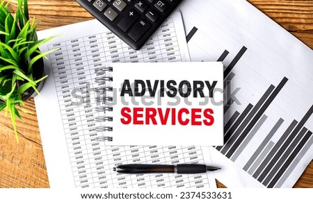 ADVISORY SERVICES text on notebook with chart and calculator