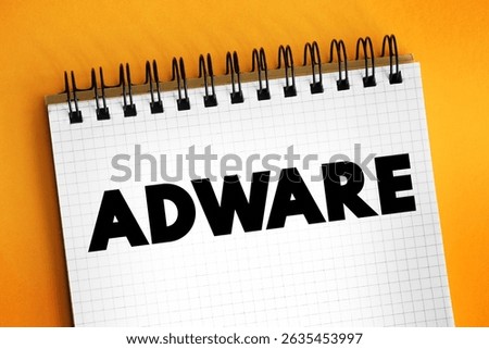 Adware - unwanted software designed to throw advertisements up on your screen, text concept on notepad