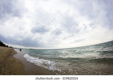 Aegean Sea, Beach And Sky With Clouds Before The Storm. Fish Eye Lens Effect 