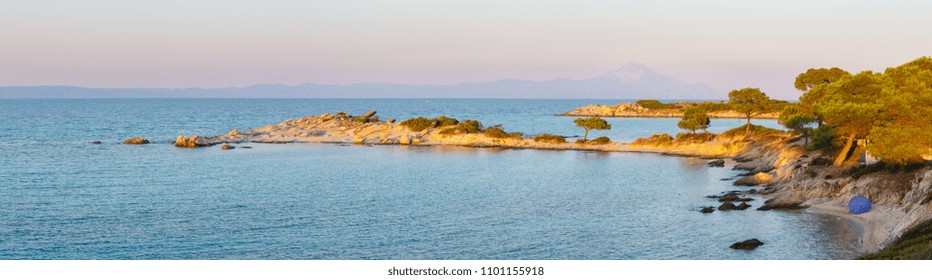 Aegean sea coast landscape, sunset view from Karidi beach (Chalkidiki, Greece). Three shots stitch high-resolution panorama.