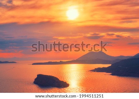 Aegean Sea with Greek islands view on sunset. Cape Sounion, Greece