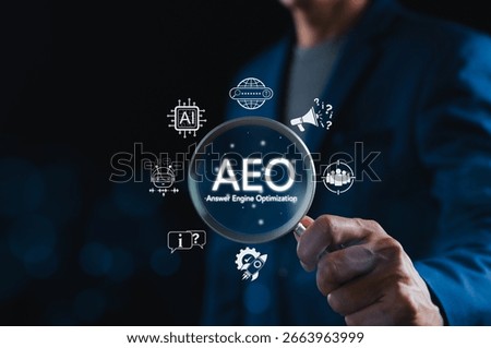 AEO Answer Engine Optimization Strategy Concept. Businessman holding magnifying glass with AEO icons, representing artificial intelligence, chatbots, search optimization, and marketing strategy.