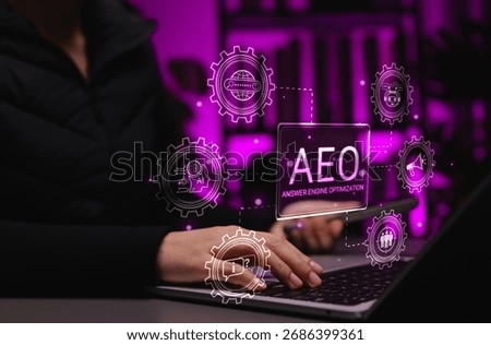 AEO strategy and AI-powered answer engine optimization. Person using laptop with icon labeled AEO and related, symbolizing answer engine optimization, not just links, voice search, smart assistant SEO