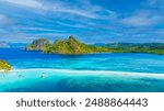 Aerail view of  tropical exotic island sand bar separating sea in two with turquoise  in El Nido, Palawan, Philippines.