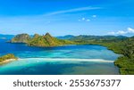 Aerail view of  tropical exotic island sand bar separating sea in two with turquoise  in El Nido, Palawan, Philippines.