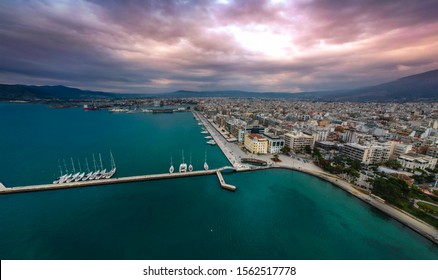 Aeral Cityscape View Of Volos City, Greece During Winter Period. Centered The Argo Wooden Boat To Be Part Of The Festive Decoration In View Of Christmas