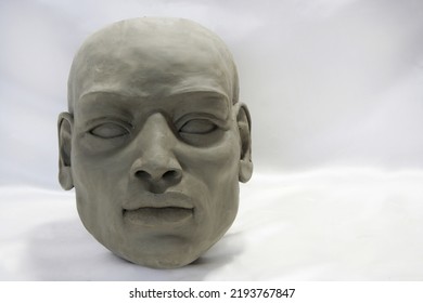 Aergilla Face Sculpture. Portrait Of African Man On White Blurred Background. Art Work, Contemporary Art, Sculpture.