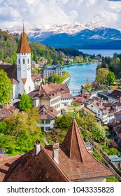 Aeria Scenery of Old Town Cityscape from Thun Castle and Alpine Mountain Range in Switzerland with Cloudy. Swiss Village among Swiss Alps. Scenic Landscape of Switzerland Country with Snowy Mountain.
