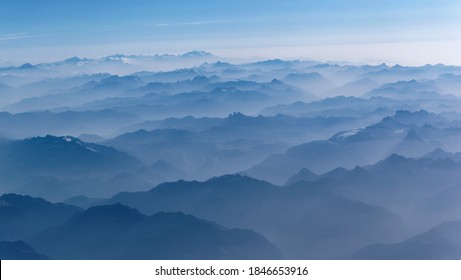 Aeria view of the blue foggy  Alps mountains