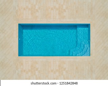 Aerial Abstract View Of Empty Swimming Pool With Tiled Area.