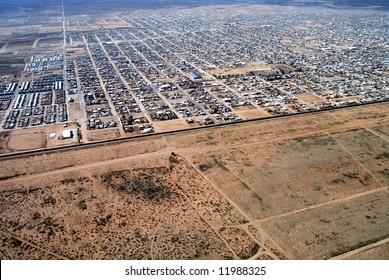 Aerial Of Agua Prieta, Mexico, Spreading Up To The U.S. Border Fence