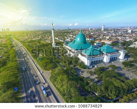 Aerial Al Akbar Mosque Surabaya, is a Located in SURABAYA INDONESIA with blue sky background