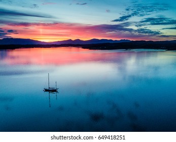 Aerial of an amazing sunset with sailing vessel at Loch Creran, Barcaldine, Argyll,Scotland