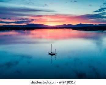 Aerial of an amazing sunset with sailing vessel at Loch Creran, Barcaldine, Argyll,Scotland