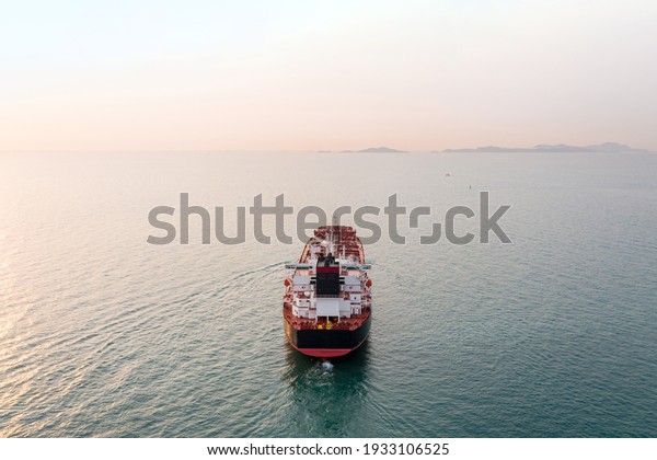 Aerial angle rear view\
of oil tanker ship sailing on open sea. Crude oil tanker lpg ngv at\
industrial estate Thailand - Oil tanker ship to Port of Singapore -\
import export