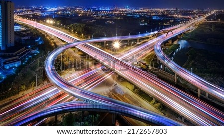 Aerial angle Rush hour traffic fast moving hyper lapse at night overhead of busy intersection traffic at night moving fast light road lane effect line light cg