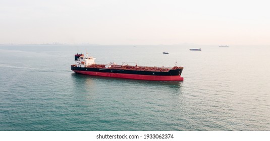 Aerial angle side view of oil tanker container ship at sea. Crude oil tanker lpg ngv at industrial estate Thailand - Oil tanker ship to Port of Singapore - import export 