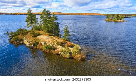 Aerial Autumn Island in Lake with Forested Shoreline