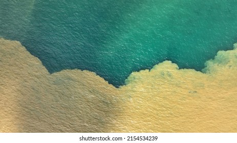 An aerial beautiful view of the freshwater meets the saltwater in bright sunlight