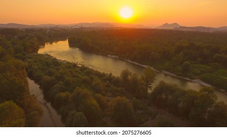 AERIAL: Beautiful Wide River With Tributary At Magical Golden Light Sunset