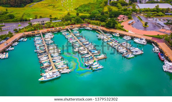 Aerial bird eye view\
Photography viewpoint urban landscape of a lot of boats yachts\
moored in marina at Tamsui Lover’s Bridge  in Fisherman\'s Wharf\
Taipei Taiwan.