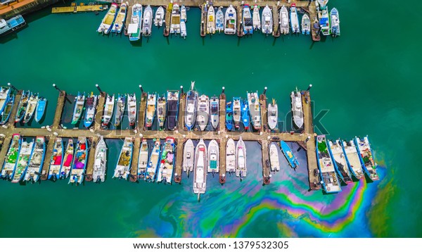 Aerial bird eye view\
Photography viewpoint urban landscape of a lot of boats yachts\
moored in marina at Tamsui Lover’s Bridge  in Fisherman\'s Wharf\
Taipei Taiwan.