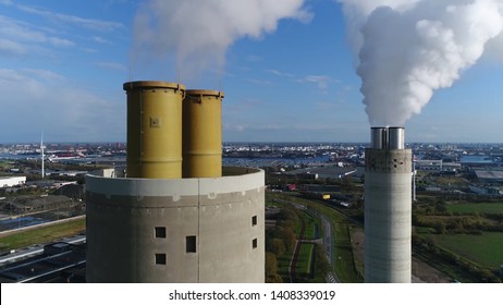 Aerial Bird View Photo Of Coal Fired Power Station Exhaust Flues Located At Thermal Plant Which Burns A Fossil Fuel To Produce Electricity By Converting Heat Of Combustion Into Mechanical Energy