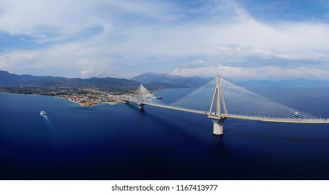 Aerial bird's eye drone panoramic photo of state of the art suspension bridge crossing the sea - Shutterstock ID 1167413977