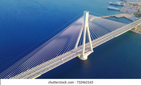 Aerial bird's eye drone photo of state of the art suspension bridge crossing Corinth Gulf, Greece - Powered by Shutterstock
