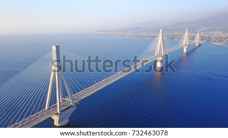 Aerial bird's eye drone photo of state of the art suspension bridge crossing the sea
