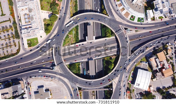 Aerial bird\'s eye photo of highway and ring road\
passing through city\
center